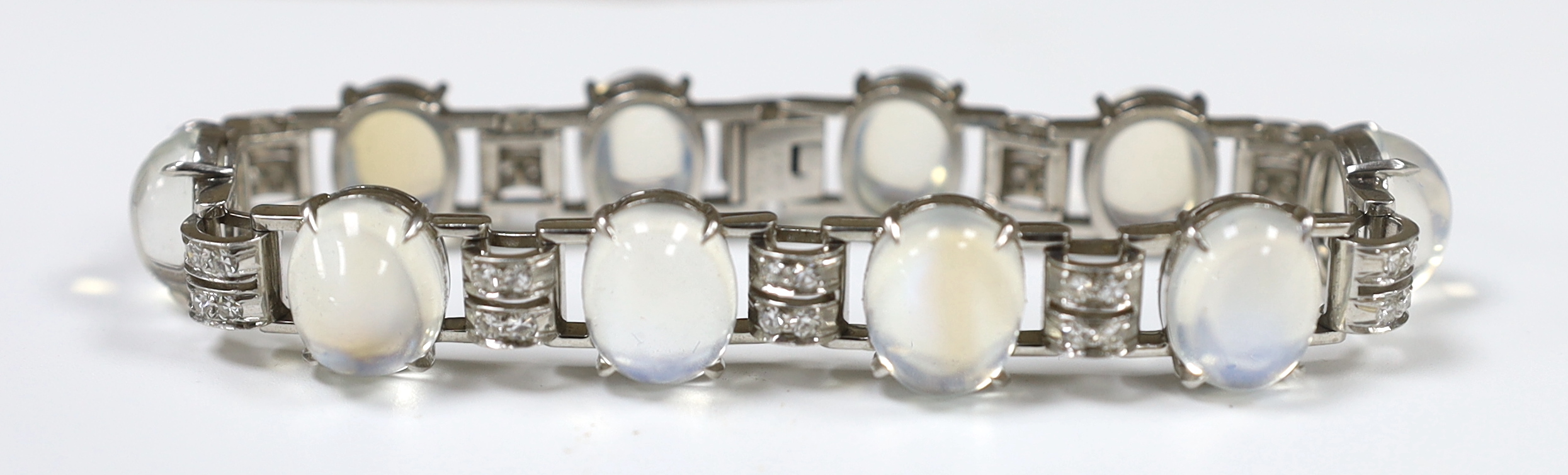 An early to mid 20th century platinum, moonstone and diamond cluster bracelet